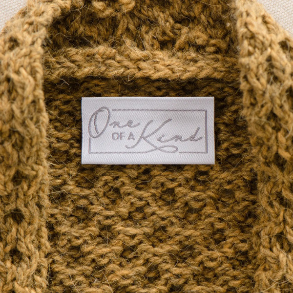 One of kind woven label sewn in the seater