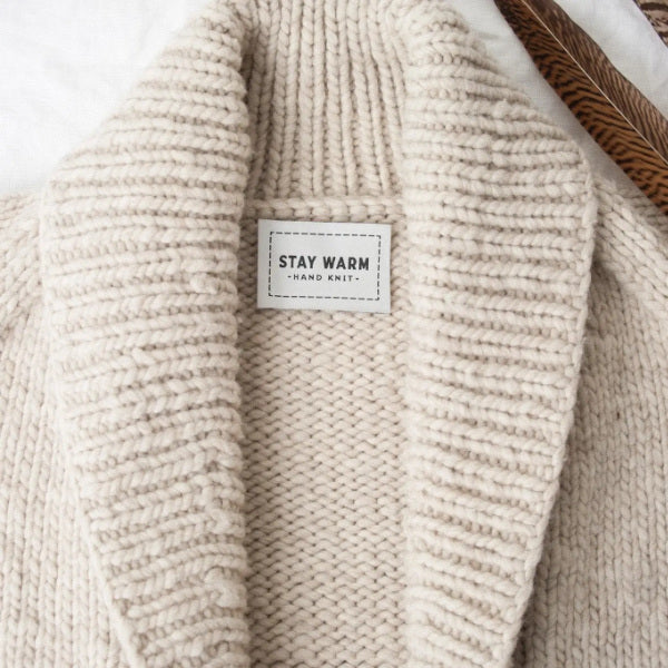 Stay Warm woven label sewn in back of sweater