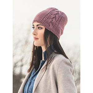 woman wearing claremont cabled hat knit in Blue Sky Fibers Woolstok yarn