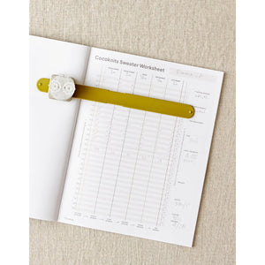inside the Cocoknits Sweater Workshop Journal with a Cocoknits Maker's Keep and Row Counter