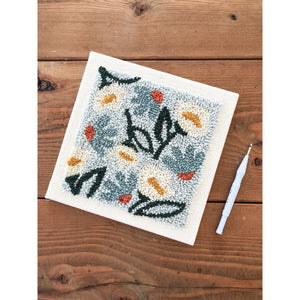 Daisies and Peonies Punch needle kit with a wood background
