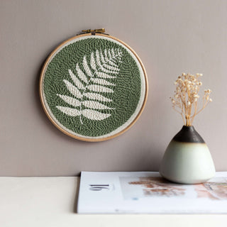 Completed Fern punch needle kit hanging on wall