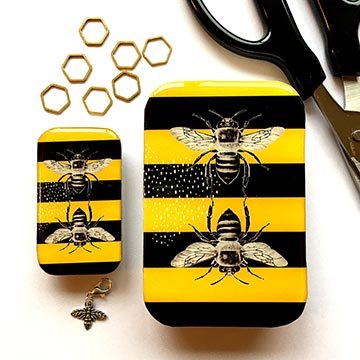 Bee notions tin with honeycomb stitch markers