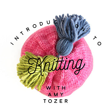 Looking down at a hand knit toddler hat