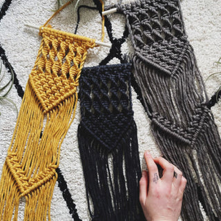 Completed examples of macrame wall hanging kits