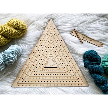 image of triangle weaving loom with hanks of yarn