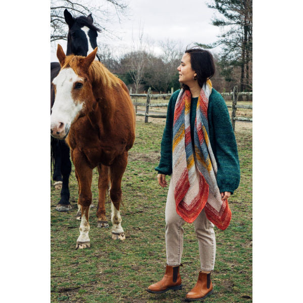 Woman wearing the yesica wrap with a horse