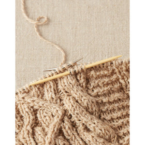 Cocoknits bamboo cable needle in a cabled sweater