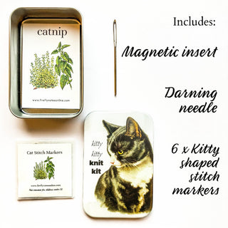 inside of resin tin with vintage cat picture showing darning needle and stitch markers
