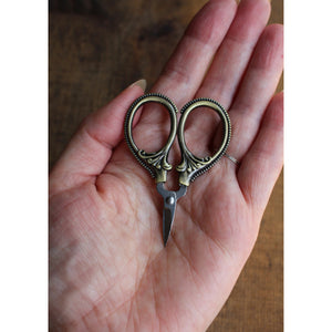 mini embroidery scissors that fit into the palm of your hand