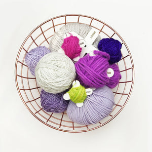 Yarn bobbins in a basket